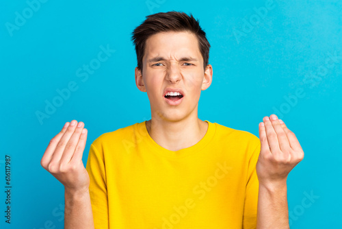 Young caucasian man wear shirt against blue background angry gesturing typical italian gesture with hand looking to camera