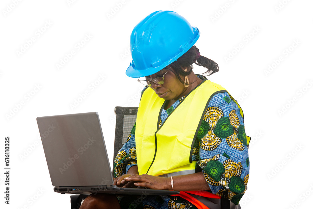 close up of female engineer in protective helmet working using laptop computer. close up of female engineer in protective helmet working using laptop computer.