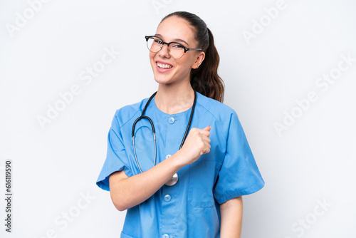 Young caucasian surgeon doctor woman isolated on white background celebrating a victory