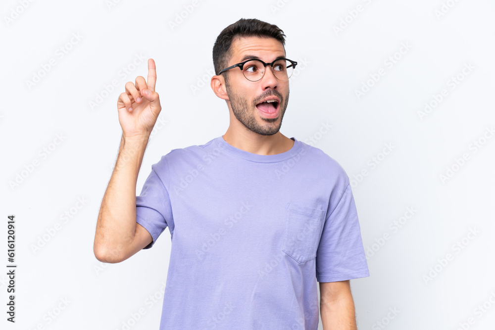 Young caucasian man isolated on white background intending to realizes the solution while lifting a finger up Young caucasian man isolated on white background intending to realizes the solution while lifting a finger up