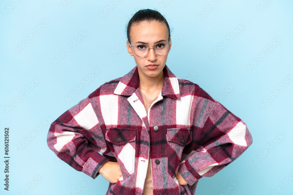 Young Arab woman isolated on blue background angry Young Arab woman isolated on blue background angry