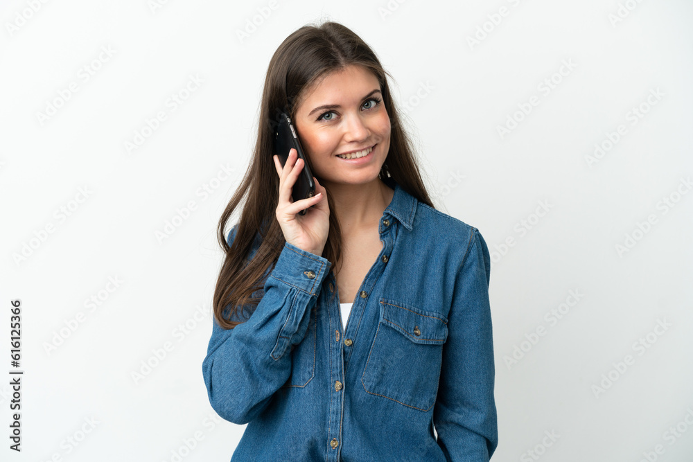 Young caucasian woman isolated on white background keeping a conversation with the mobile phone with someone Young caucasian woman isolated on white background keeping a conversation with the mobile phone with someone