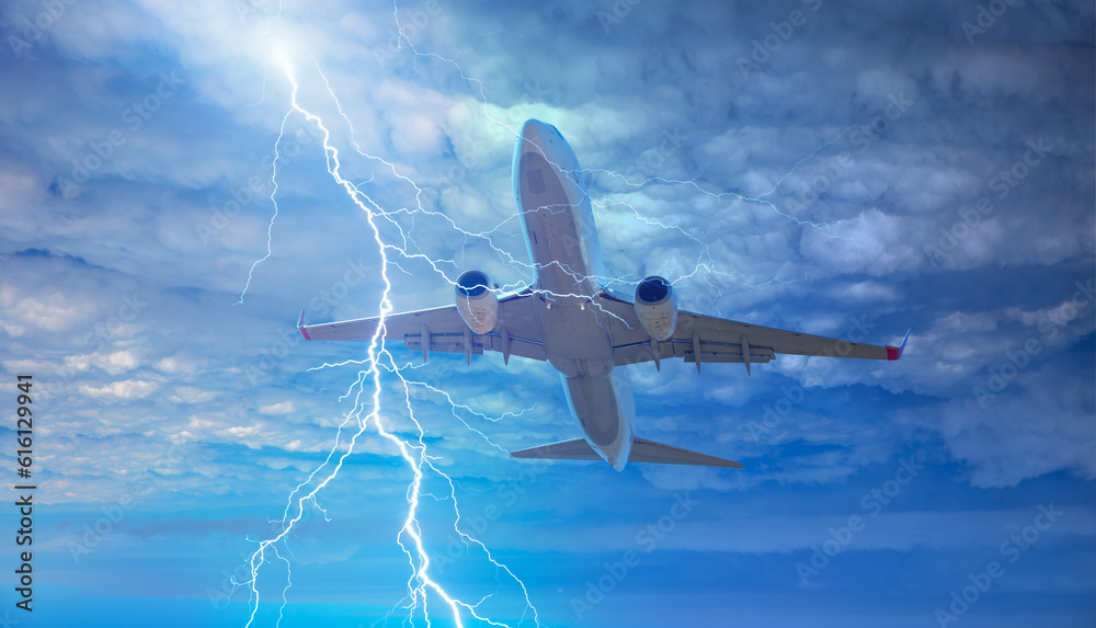 Fototapeta premium Airplane in the sky with thunder and lightning