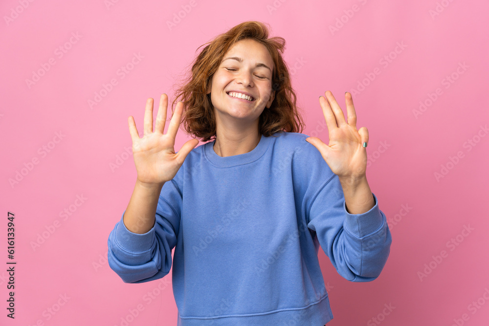 Young Georgian woman isolated on pink background counting nine with fingers Young Georgian woman isolated on pink background counting nine with fingers