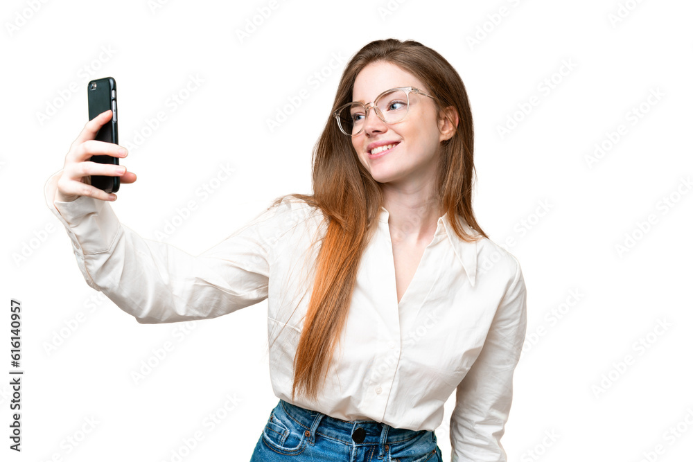 Young pretty woman over isolated chroma key background making a selfie Young pretty woman over isolated chroma key background making a selfie