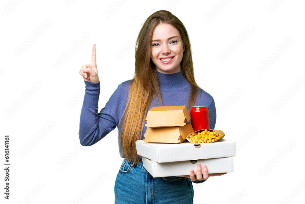 Young pretty woman holding pizzas and burgers over isolated chroma key background pointing up a great idea Young pretty woman holding pizzas and burgers over isolated chroma key background pointing up a great idea