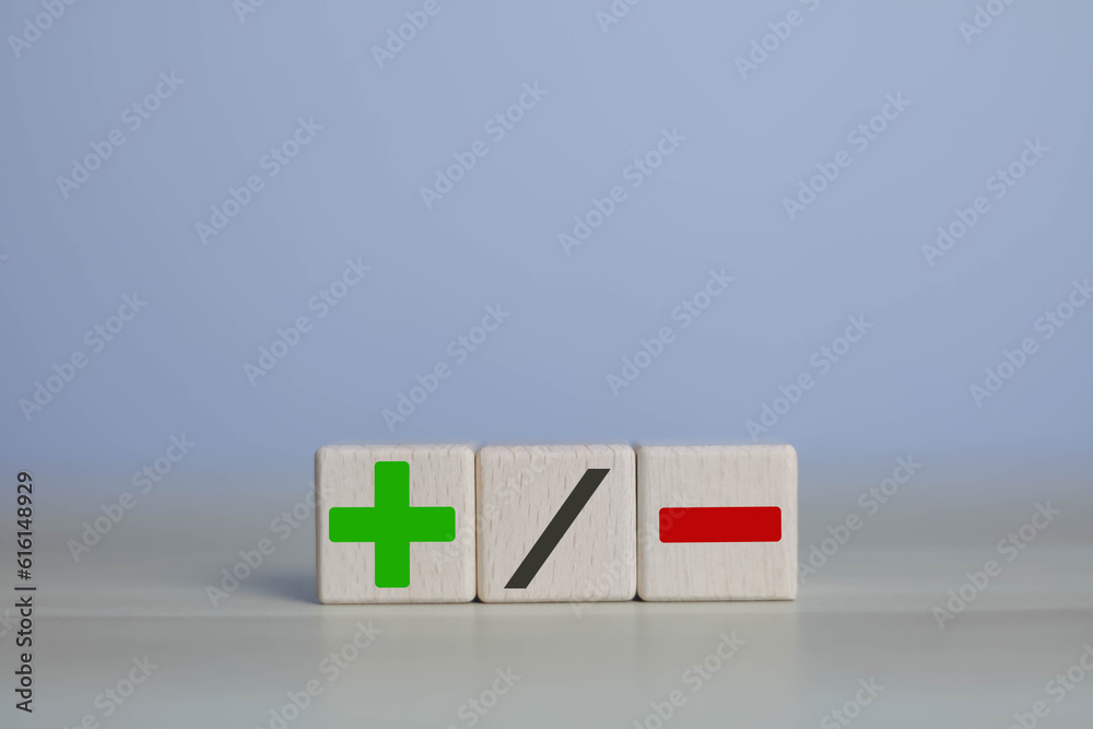 wooden blocks with plus and minus signs Comparatively opposite concepts ...