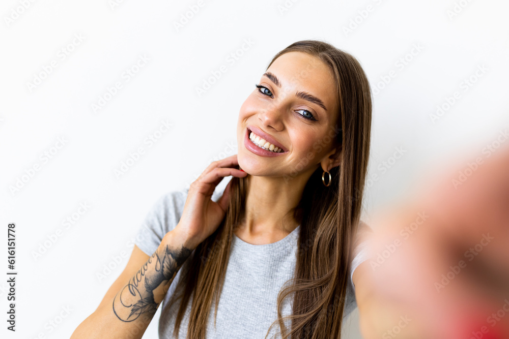 Young happy smile woman take selfie on white background Young happy smile woman take selfie on white background