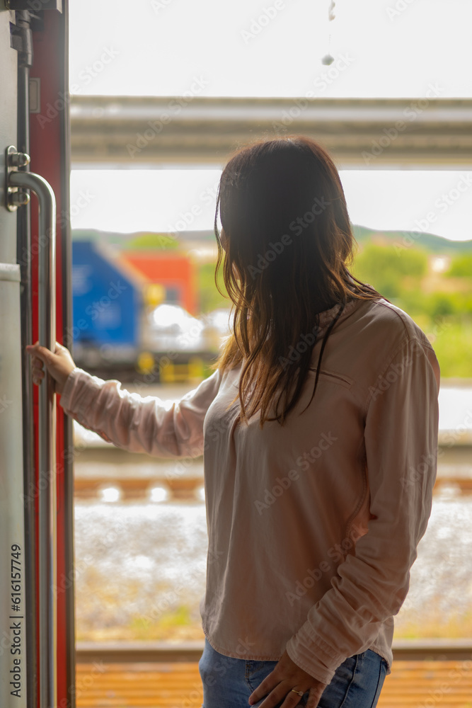 Obraz premium A woman in the train door