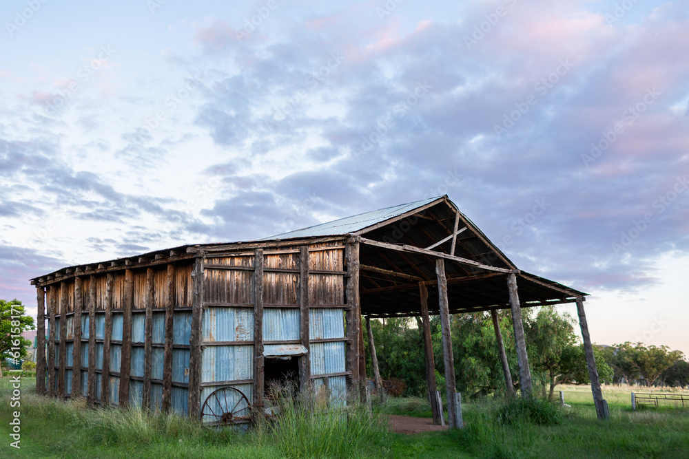 Dilapidated old farm hay shed at dusk on Australian farm Dilapidated old farm hay shed at dusk on Australian farm