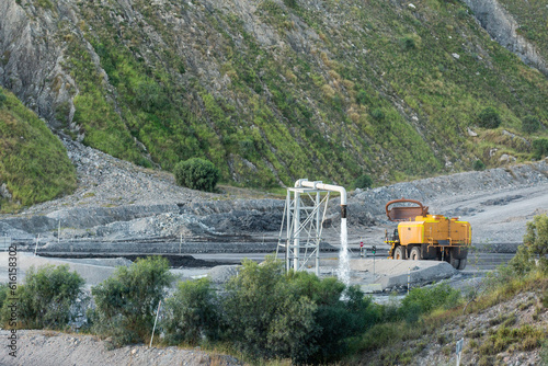 water truck filled up ready to spray water to keep down dust photo