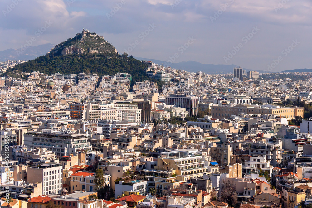 Aerial panorama of Athens city with parlament building and Mount Lycabettus (Lykavittos). Athens, Greece