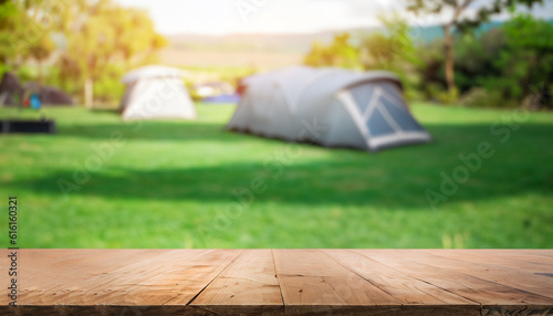 Wood table of free space and Camping Tent in in the forest at summer time. Can used for display or montage your products.