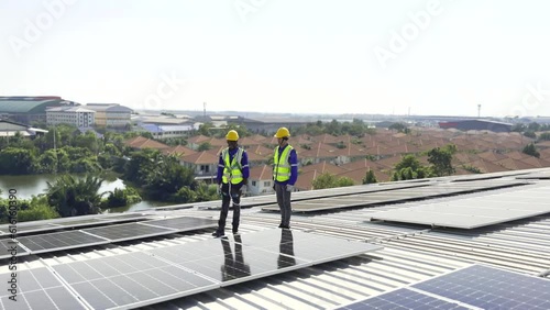 Wallpaper Mural Modern solar farm on a roof under the sky. Workers in uniform and protective helmets discuss the solar panels installation. Torontodigital.ca