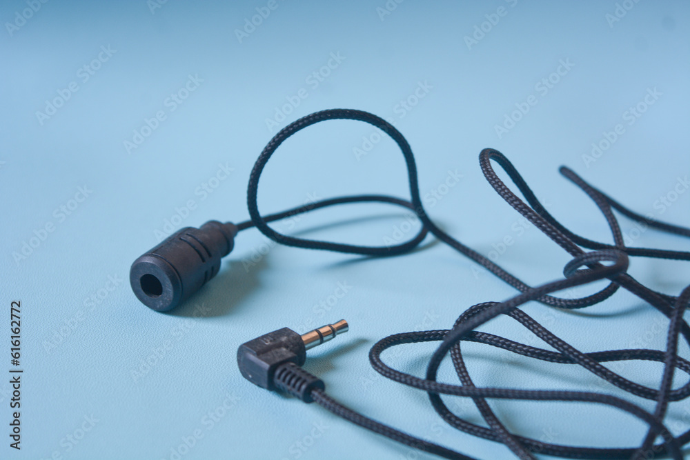 Black microphone cable on white background. Black microphone cable on white background.