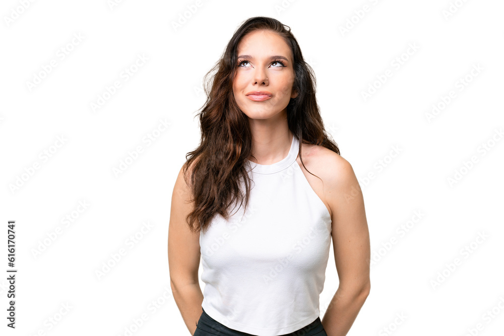 Young caucasian woman isolated over isolated background and looking up Young caucasian woman isolated over isolated background and looking up