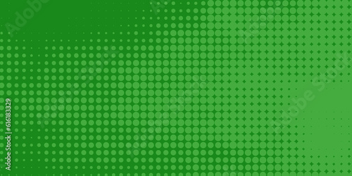 green dots background. pop art halftone background in comic style with gradation of dots design, graphic illustration background. idea for banner image or to add graphic texture to any designs.