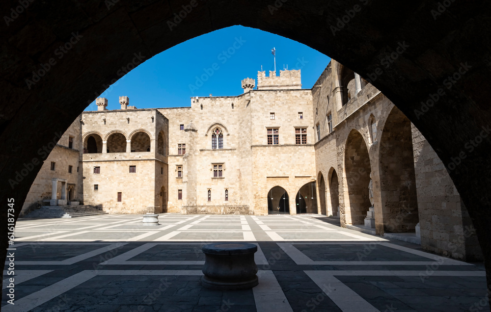 A Gothic Arch Frames Partial Interior Courtyard and Palace of the Grand Master of the Knights of Rhodes Greece