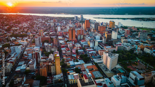 Aerial Drone Fly Above Asuncion City Waterfront in Paraguay, Daylight Cityscape Panorama of South American River photo