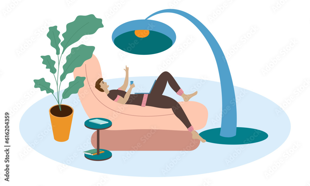 Obraz premium Creative man looking for inspiration while lying in an easy chair with a laptop