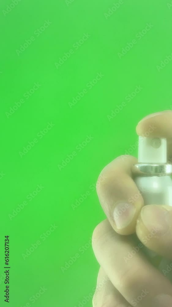 spray can man presses a button on an aerosol can, releasing chemicals