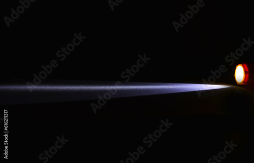 beam of light rays from a torch in dark