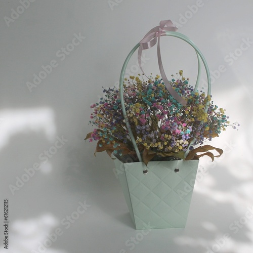 Bouquet of colorful dried flowers in blue box
