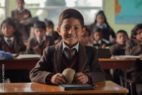 Boy smiles while using tablet in classroom