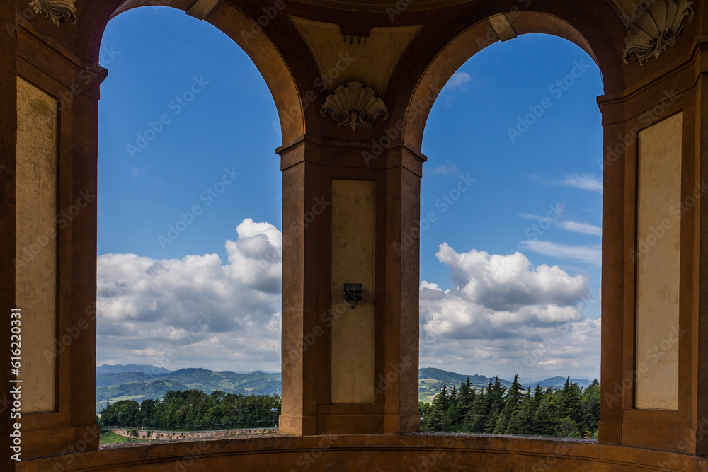 View of a landscape through the arch windows of Santuario Madonna di San Luca