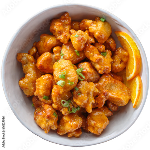 chinese orange chicken in bowl on transparent background shot from overhead view 