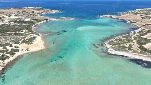 Fototapeta Naklejka Na Ścianę i Meble -  Aerial drone photo of paradise turquoise coloured nudist beach near camping of Northern part of Antiparos island, Cyclades, Greece