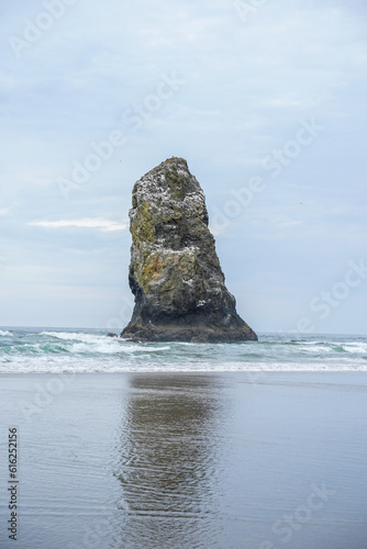 Cannon Beach along the Oregon Coast. Large boulders, sand, and ocean.