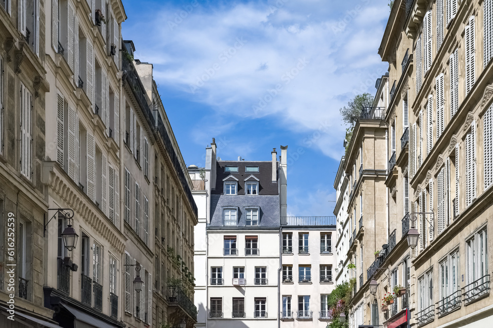 Paris, buildings in the Marais, in the center, in a typical street
