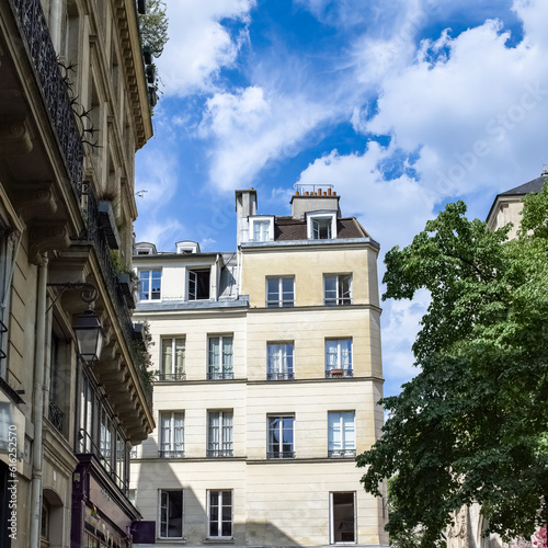 Paris, buildings in the Marais, in the center, in a typical street 