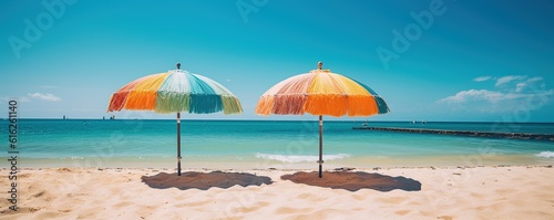 beach chairs and umbrellas on a tropical white sand beach