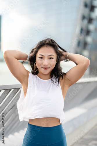 Free Download Urban portrait of a beautiful Asian ethnicity young sporty woman - GFXLoad