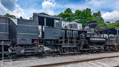 Close Up View of a Antique Shay Steam Locomotive's Running Gears as it's Warming Up For Days Work