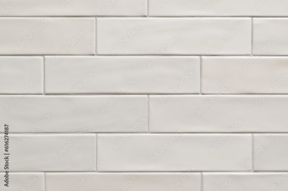 White smooth long thin horizontal tile pattern on a wall, background image. Color swatch design sample. White smooth long thin horizontal tile pattern on a wall, background image. Color swatch design sample.