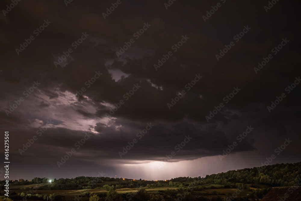 Storm clouds and lightning in the night sky