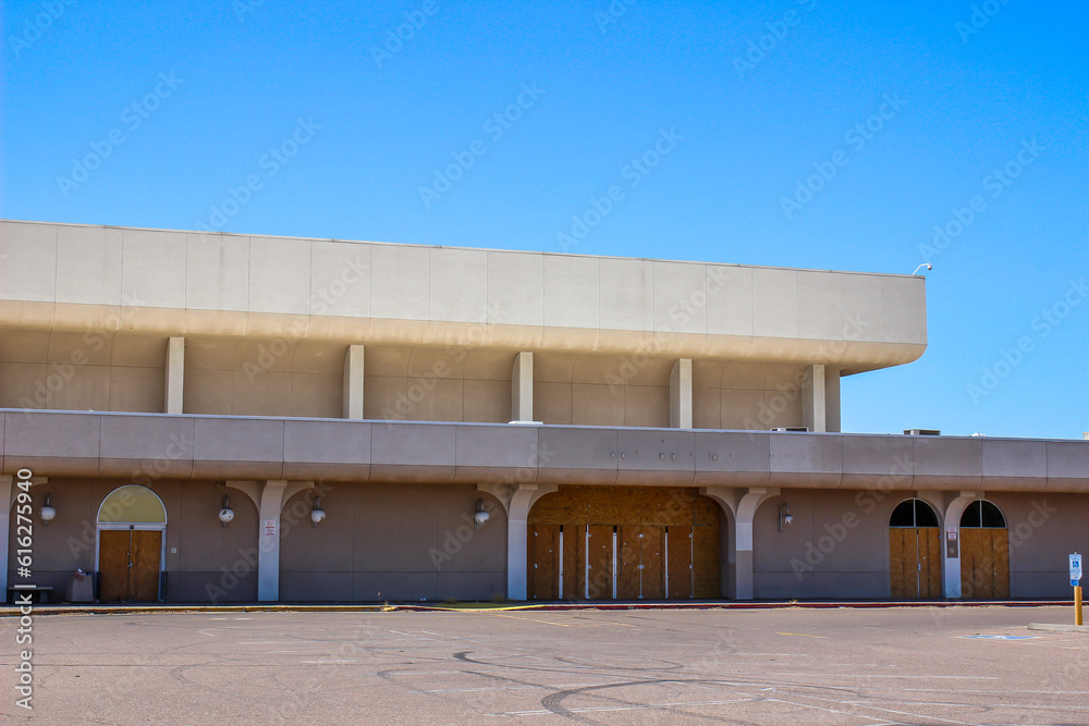 Abandoned Department Store With Boarded Up Entrances