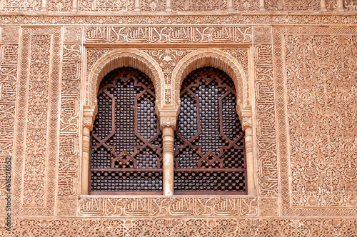 Islamic calligraphy on a window frame with floral designs © SakhanPhotography