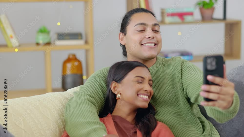 Couple, selfie and happy, bonding with love and relax on couch, interracial with trust and support in relationship. Young people at home together, smile and posing in picture for social media post Couple, selfie and happy, bonding with love and relax on couch, interracial with trust and support in relationship. Young people at home together, smile and posing in picture for social media post