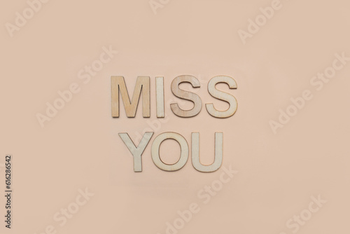 Miss you in wooden letters