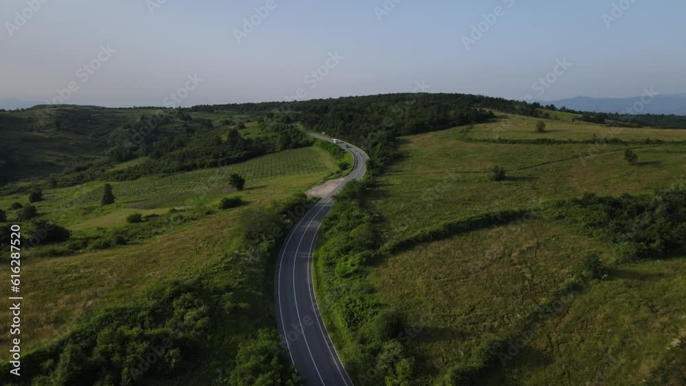 Aerial Drone View Car Driving on Curvy Mountain asphalt Road in summer Aerial Drone View Car Driving on Curvy Mountain asphalt Road in summer