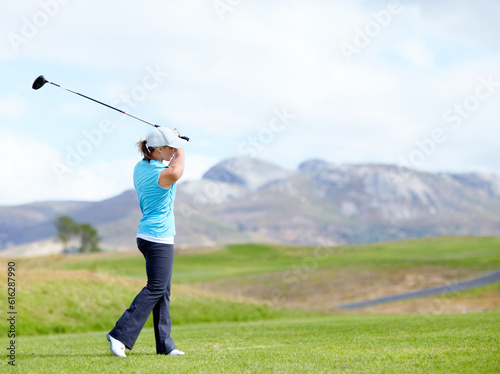 Driver, girl or golfer playing golf for fitness, workout or exercise with a swing on a green course. Wellness, woman golfing or athlete training in action or sports game driving with a club stroke