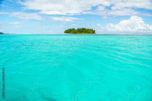 Small Island in the blue water in Bora Bora, French Polynesia