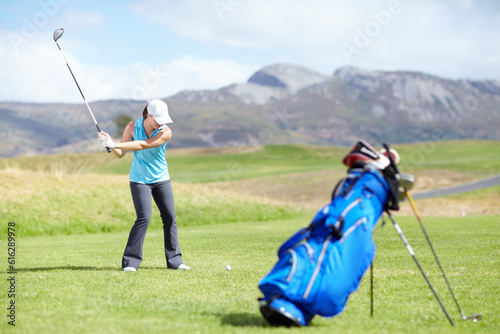 Driver, woman or golfer playing golf for fitness, workout or exercise with a swing on a green course. Wellness, girl golfing or athlete training in action or sports game driving with a club stroke