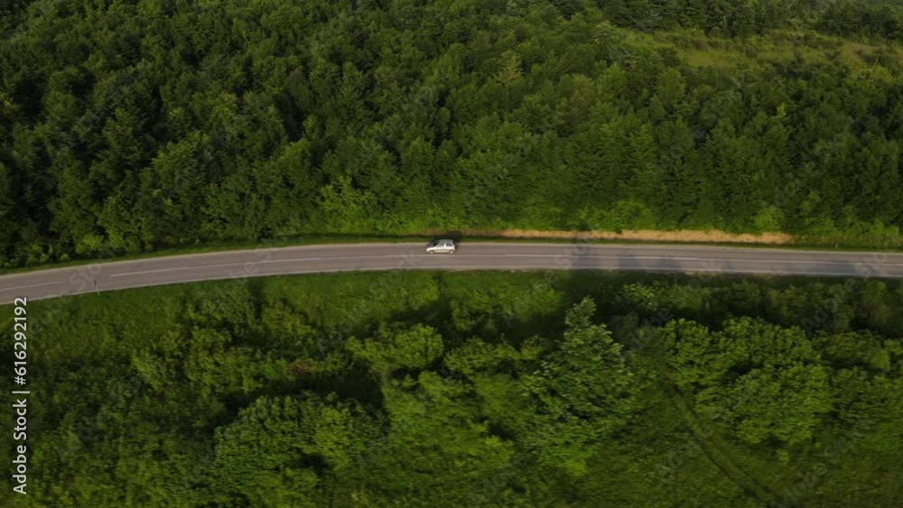 Aerial Drone View Car Driving on Curvy Mountain asphalt Road in summer