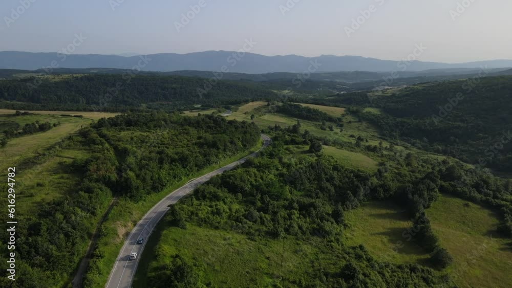 Aerial Drone View Car Driving on Curvy Mountain asphalt Road in summer Aerial Drone View Car Driving on Curvy Mountain asphalt Road in summer