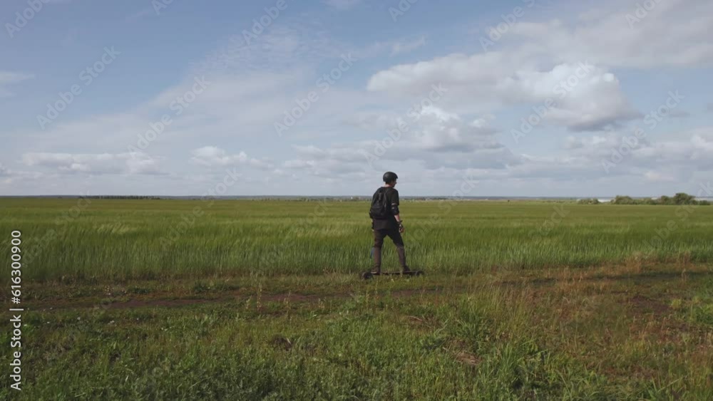 Aerial photography of a skateboarder in nature, a man on an electric skateboard, riding an electric skateboard in nature, electric longboard evolve, electric skateboard evolve Aerial photography of a skateboarder in nature, a man on an electric skateboard, riding an electric skateboard in nature, electric longboard evolve, electric skateboard evolve